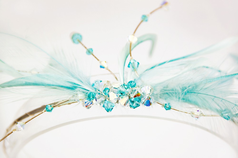 Close up of Mother of the bride headpiece in blue